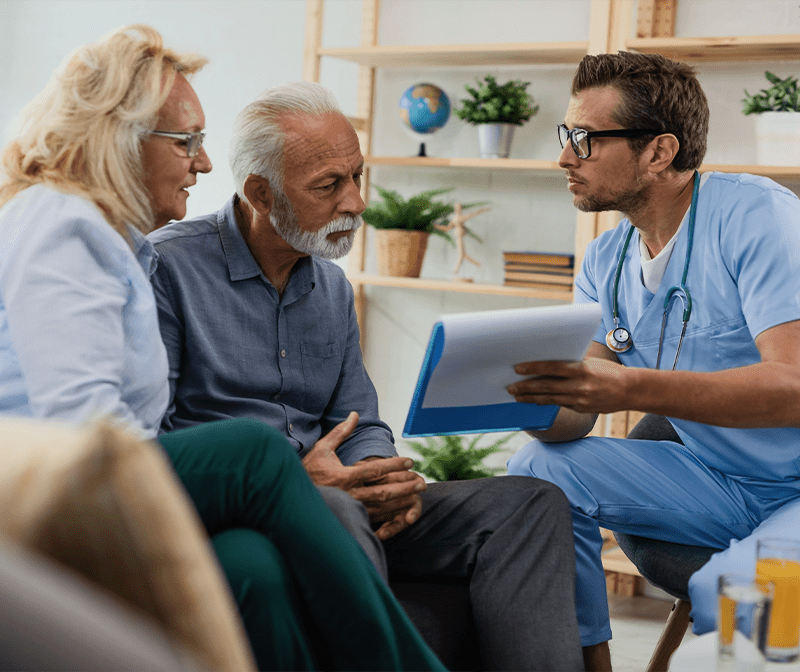A Senior Couple Talking With A Nurse